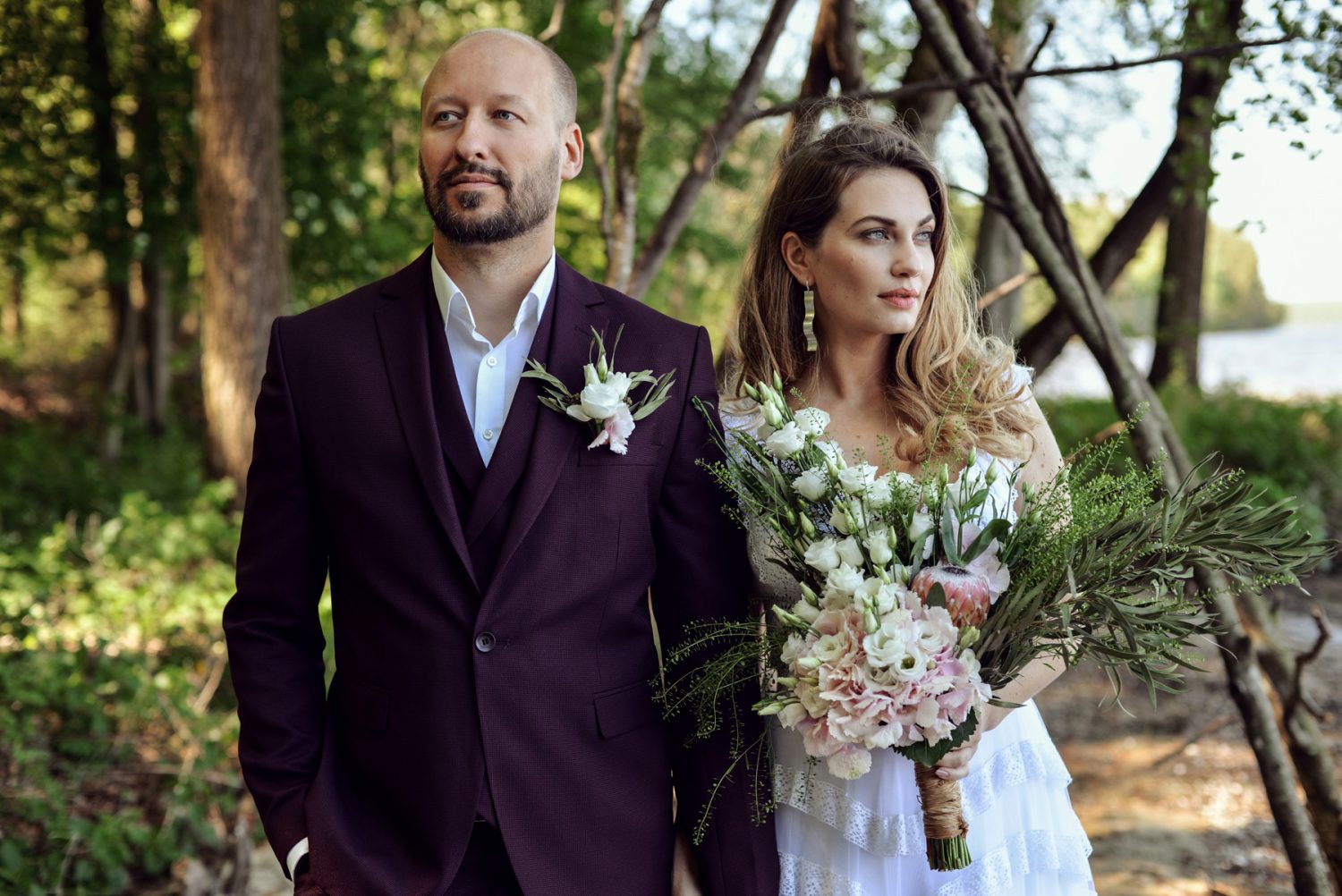 Boho couple getting married in the woods