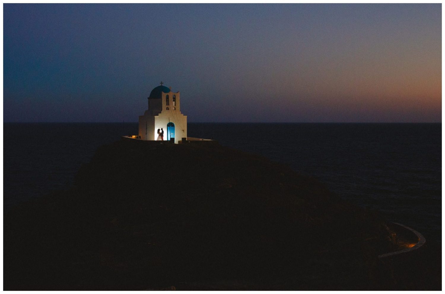Dreamy shot of the Panagia Chryssopigi chapel during Vaso's wedding in Sifnos island