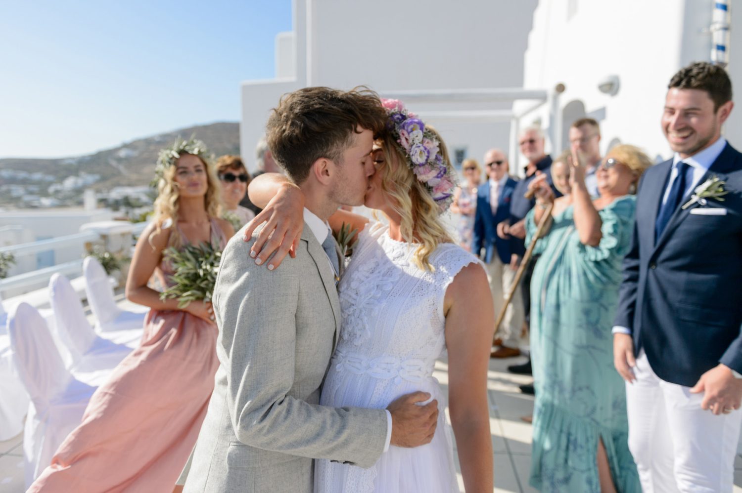 Stephen kissing Jess, during the Flying the Nest wedding in Mykonos island