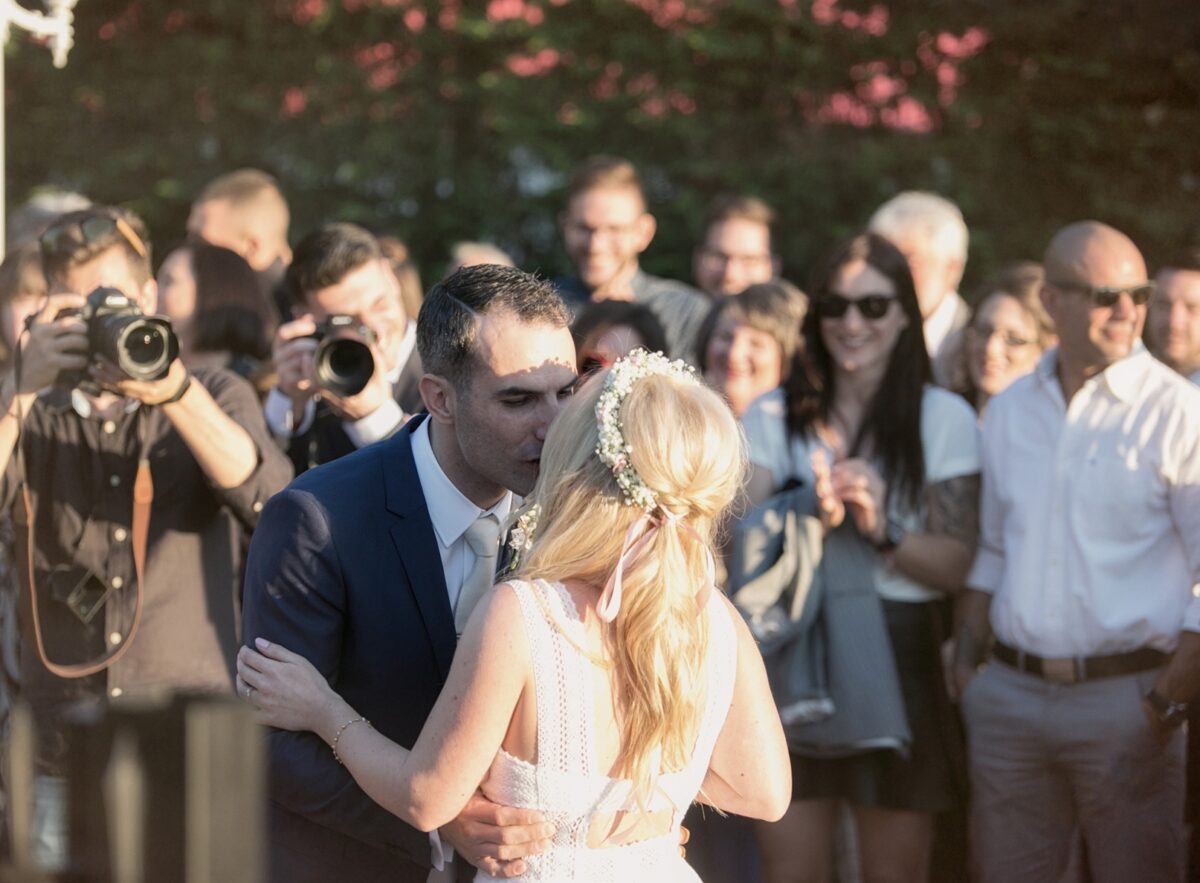 Groom kissing the bride during their wedding in Le Chevalier Platinum Estate