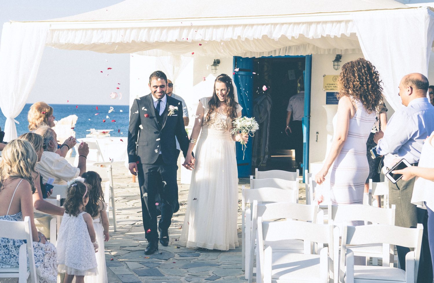 Flower petals in the air, for Georgina & Diogenis's wedding in Protaras, Cyprus