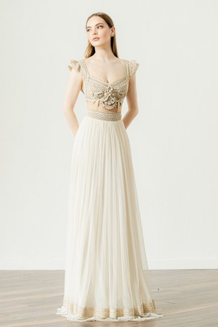 Model wearing the Vintage Boho Wedding Dress: 'Ijunia Opulence' by Atelier Zolotas