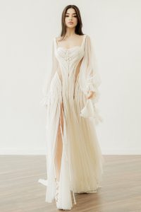 'Joy' by Atelier Zolotas – backless wedding dress with sleeves, featuring a crochet motif and front slits