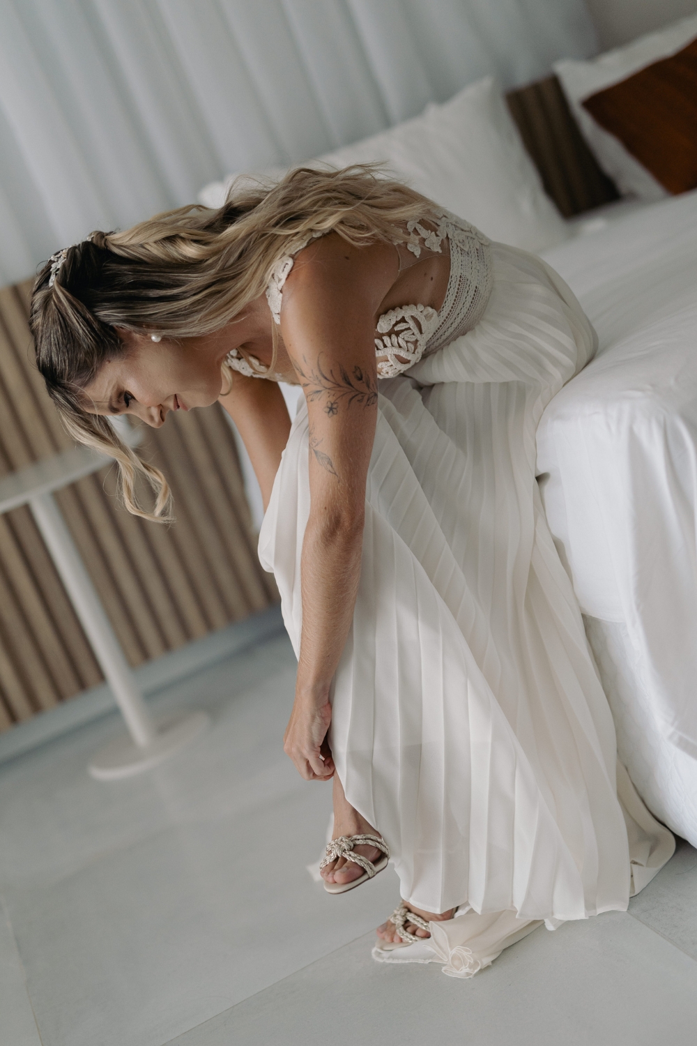 bride-preparation-wearing-bridal-shoes-and-atelier-zolotas-wedding-dress (5) Bride wearing her shoes during wedding preparation, in a crochet wedding dress by Atelier Zolotas