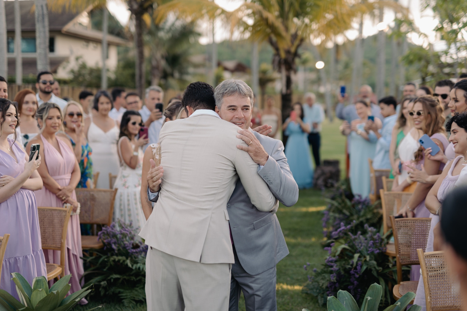 wedding-in-praia-dos-carneiros-groom-and-father-of-the-bride-hug 5)
